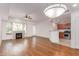Open living room boasts a fireplace, hardwood floors, and modern lighting at 16 W Encanto Blvd # 26, Phoenix, AZ 85004