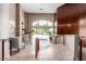 Bright lobby featuring tile floors, wood accents, front door, and plant accents at 16 W Encanto Blvd # 26, Phoenix, AZ 85004