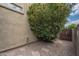 Landscaped backyard with a garden and a wooden gate, perfect for outdoor enjoyment and privacy at 1650 S Crismon Rd # 63, Mesa, AZ 85209