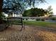 Enjoy the serene backyard featuring lush landscaping, a bench, and lovely sunset views at 1650 S Crismon Rd # 63, Mesa, AZ 85209
