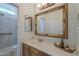 Bright bathroom featuring a framed mirror, vanity with sink, and a tiled walk-in shower at 1650 S Crismon Rd # 63, Mesa, AZ 85209