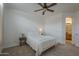 Bright bedroom with a neutral color scheme and carpet with views into the bathroom at 1650 S Crismon Rd # 63, Mesa, AZ 85209