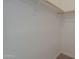 Walk-in closet with wood rod and shelf above for organized storage at 1650 S Crismon Rd # 63, Mesa, AZ 85209