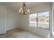 Dining area featuring tile flooring and a large window with neighborhood view at 1650 S Crismon Rd # 63, Mesa, AZ 85209