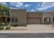 Single-story home featuring a private garage and driveway with desert landscaping at 1650 S Crismon Rd # 63, Mesa, AZ 85209