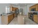 Well-equipped kitchen boasting stainless steel appliances, breakfast bar, and tile flooring at 1650 S Crismon Rd # 63, Mesa, AZ 85209