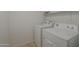 Laundry room with white washer and dryer and shelving at 1650 S Crismon Rd # 63, Mesa, AZ 85209