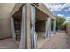 Exterior view of covered patio with seating, blue curtains, and neutral color scheme at 1650 S Crismon Rd # 63, Mesa, AZ 85209