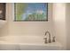 Close-up of a faucet on a granite countertop at 1655 W Stanford Ave, Gilbert, AZ 85233