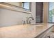 Close-up of a faucet on a granite countertop at 1655 W Stanford Ave, Gilbert, AZ 85233