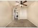 Bedroom with ceiling fan, closet with sliding doors and ensuite bath entrance at 1655 W Stanford Ave, Gilbert, AZ 85233