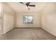 Large bedroom with a ceiling fan and ample natural light from the window at 1655 W Stanford Ave, Gilbert, AZ 85233