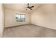 Spacious bedroom with a ceiling fan and a large window providing natural light at 1655 W Stanford Ave, Gilbert, AZ 85233