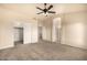 View of a bedroom with carpeted floors, a ceiling fan and a closet at 1655 W Stanford Ave, Gilbert, AZ 85233