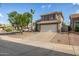 Charming two-story home with a two-car garage and desert landscaping at 1655 W Stanford Ave, Gilbert, AZ 85233
