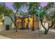 Charming home on a corner lot with mature trees, desert landscaping, and street sign at 1655 W Stanford Ave, Gilbert, AZ 85233