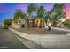 Charming home on a corner lot with mature trees and desert landscaping and exterior arches at 1655 W Stanford Ave, Gilbert, AZ 85233