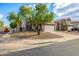 Attractive two-story home with a spacious driveway, mature trees, and well-kept landscaping at 1655 W Stanford Ave, Gilbert, AZ 85233