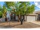 Beautiful two-story home featuring a large garage, a tiled roof, and well-maintained landscaping at 1655 W Stanford Ave, Gilbert, AZ 85233