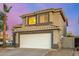 Beautiful two-story home featuring a large garage, a tiled roof, and well-maintained landscaping at 1655 W Stanford Ave, Gilbert, AZ 85233