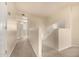 Upstairs hallway with carpet and an open doorway to a bedroom at 1655 W Stanford Ave, Gilbert, AZ 85233