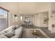 Open-concept living area leading into dining room with views through large window at 1655 W Stanford Ave, Gilbert, AZ 85233