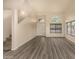 Spacious living room with high ceilings, wood-look floors, and lots of natural light at 1655 W Stanford Ave, Gilbert, AZ 85233