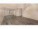Bright living room with wood-look floors, high ceilings, and staircase at 1655 W Stanford Ave, Gilbert, AZ 85233