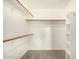 Spacious walk-in closet featuring built-in shelving and ample storage space at 1655 W Stanford Ave, Gilbert, AZ 85233