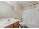 Bathroom with tub, shower, wood vanity and classic fixtures at 1660 E Zinnia St, Casa Grande, AZ 85122
