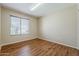 Bedroom featuring hardwood floors and a sunlit window at 1660 E Zinnia St, Casa Grande, AZ 85122