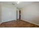 Bedroom featuring hardwood floors, closet and a window at 1660 E Zinnia St, Casa Grande, AZ 85122