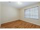 Neutral bedroom with window, hardwood floors and neutral walls at 1660 E Zinnia St, Casa Grande, AZ 85122
