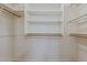Walk-in closet with wood floor and custom wood shelving at 1660 E Zinnia St, Casa Grande, AZ 85122