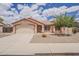 Charming single-story home featuring a well-maintained yard, tile roof, and attached two-car garage at 1660 E Zinnia St, Casa Grande, AZ 85122