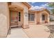 Inviting front entryway with an arched porch, security door, and decorative address tile at 1660 E Zinnia St, Casa Grande, AZ 85122