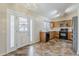 Open kitchen with stainless steel appliances, wood cabinets, and ample counter space at 1660 E Zinnia St, Casa Grande, AZ 85122
