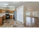 Eat-in kitchen showcasing stainless appliances, wood cabinetry, and adjoining living space at 1660 E Zinnia St, Casa Grande, AZ 85122