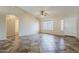 Open living area featuring a ceiling fan, neutral walls, and archways at 1660 E Zinnia St, Casa Grande, AZ 85122