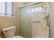 Bathroom shower featuring a sliding glass door, handrails and shelves at 1660 E Zinnia St, Casa Grande, AZ 85122