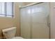 Bathroom shower featuring a sliding glass door, handrails and shelves at 1660 E Zinnia St, Casa Grande, AZ 85122