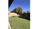 Serene backyard with lush artificial grass and a picnic table, perfect for outdoor relaxation and entertainment at 17225 W Carmen Dr, Surprise, AZ 85388