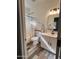 Elegant bathroom with a tub-shower, a bright window, a white sink vanity, and modern lighting, a clean and functional space at 17225 W Carmen Dr, Surprise, AZ 85388