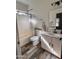 Stylish bathroom with white vanity, decorative mirror, and a shower-tub combination, showcasing modern fixtures at 17225 W Carmen Dr, Surprise, AZ 85388