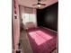 Bedroom with a large pink rug, ceiling fan, and blackout corner at 17225 W Carmen Dr, Surprise, AZ 85388