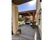 Relaxing covered patio with modern fire pit, comfortable outdoor seating, and a hammock at 17225 W Carmen Dr, Surprise, AZ 85388