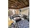 Covered patio area with outdoor seating, a modern fire pit, and a ceiling fan at 17225 W Carmen Dr, Surprise, AZ 85388