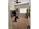 Workout room with stationary bike, large mirror, and window with blinds at 17225 W Carmen Dr, Surprise, AZ 85388