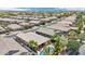 An aerial view showing homes in a residential area and a yard with covered patio and outdoor pool at 19002 N Arbor Dr, Maricopa, AZ 85138
