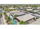 An aerial view of several homes in a residential neighborhood, with one featuring a private pool and lounge area at 19002 N Arbor Dr, Maricopa, AZ 85138